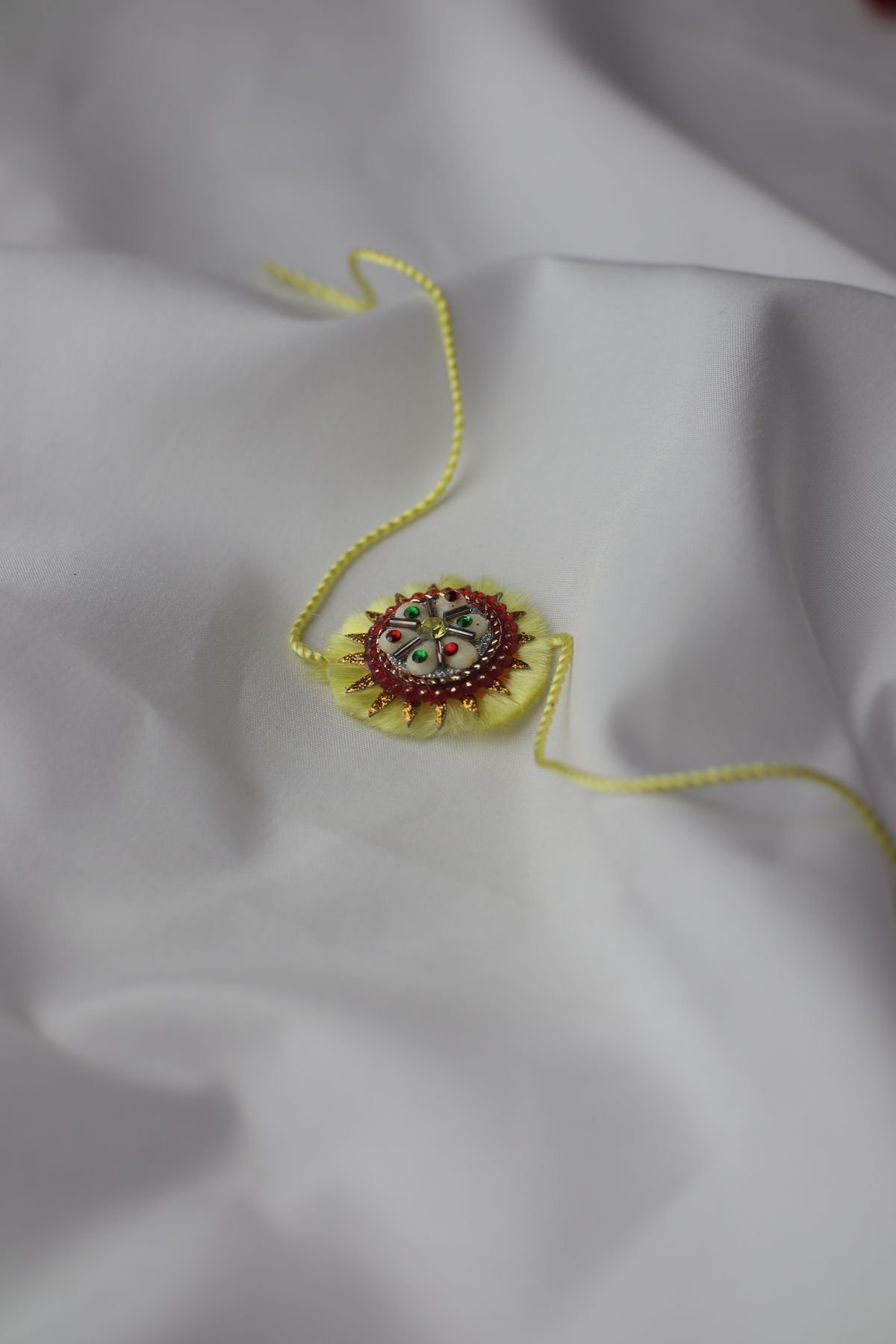Raksha Bandhan ki thali — rakhi, roli aur diya sajaye hue